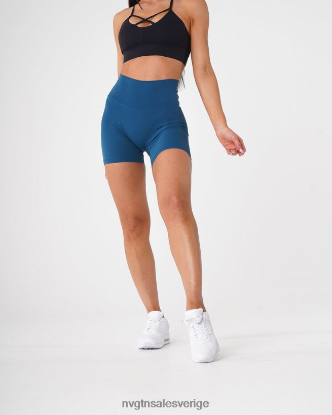 B886LB466 Stillahavsblå kondition NVGTN kvinnor signatur 2.0 shorts