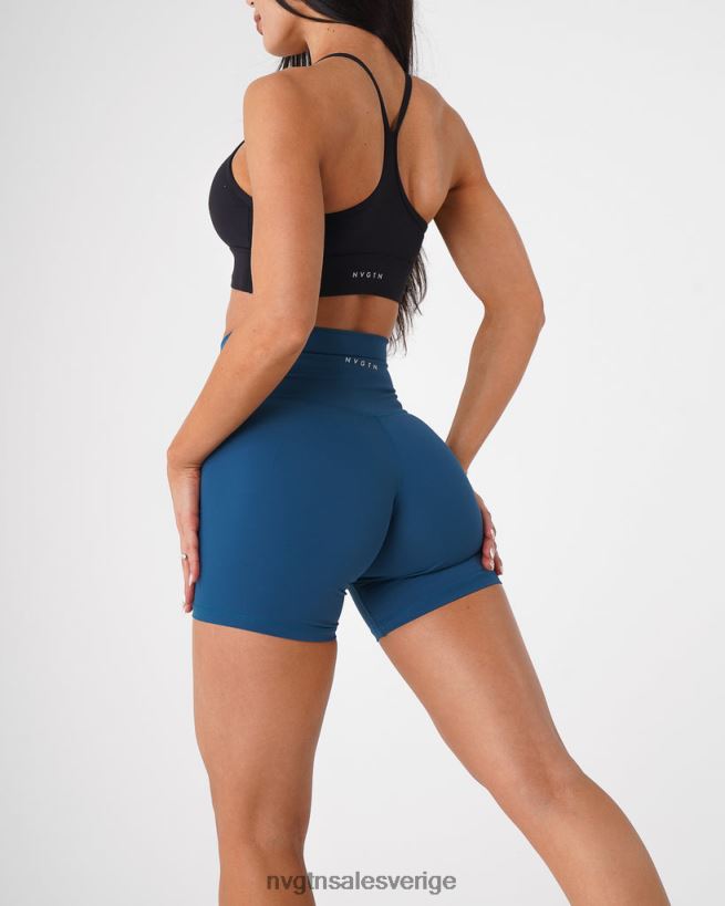 B886LB466 Stillahavsblå kondition NVGTN kvinnor signatur 2.0 shorts